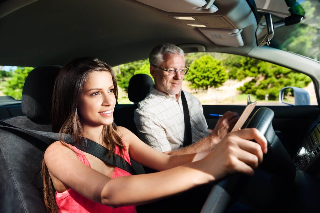 Student learning to drive with professional instructor
